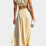 Minimalista Jocelyn Garais szett magas nyakkal és oldalsó nyitásokkal