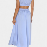 Minimalista Jocelyn Garais szett magas nyakkal és oldalsó nyitásokkal